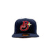 A navy blue baseball cap featuring a red and white embroidered 'Brooklyn Bodega Association' logo with a yellow star on the front, set against a plain light gray background.
